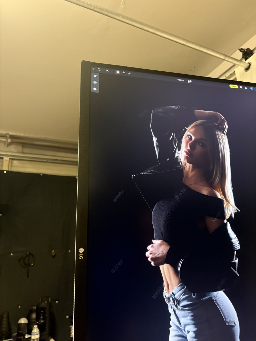 A leather jacket portrait of Madeline on the editing monitor